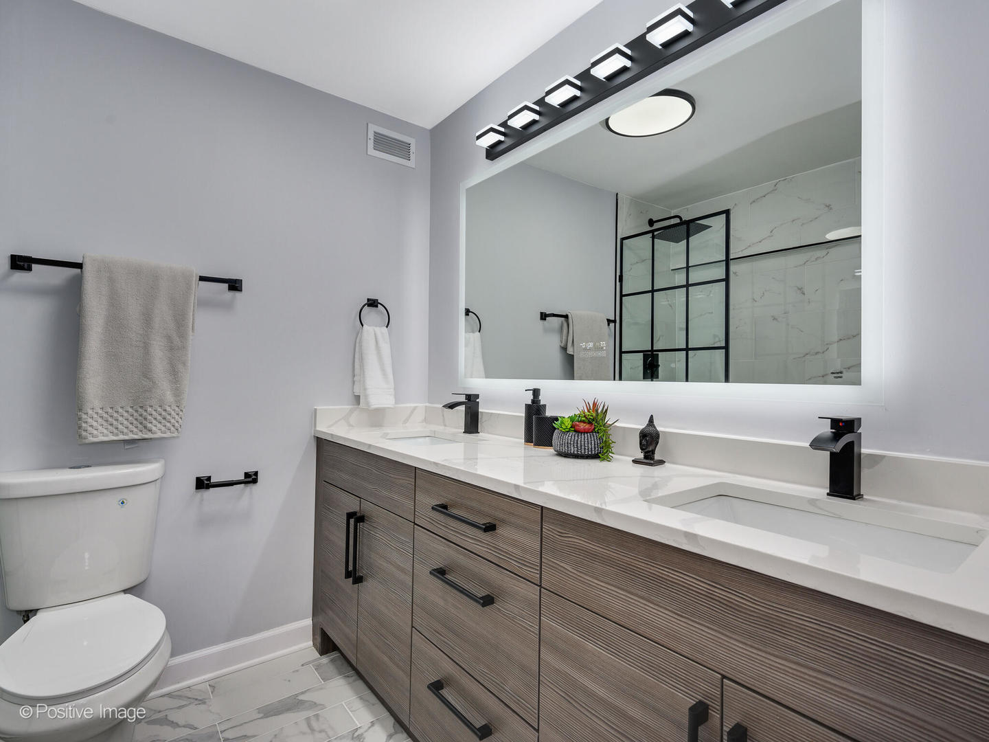 5445 North Sheridan Road, Unit 3404 Chicago, IL 60640 - Photo 19 of 24 a bathroom with a granite countertop sink a toilet and a mirror