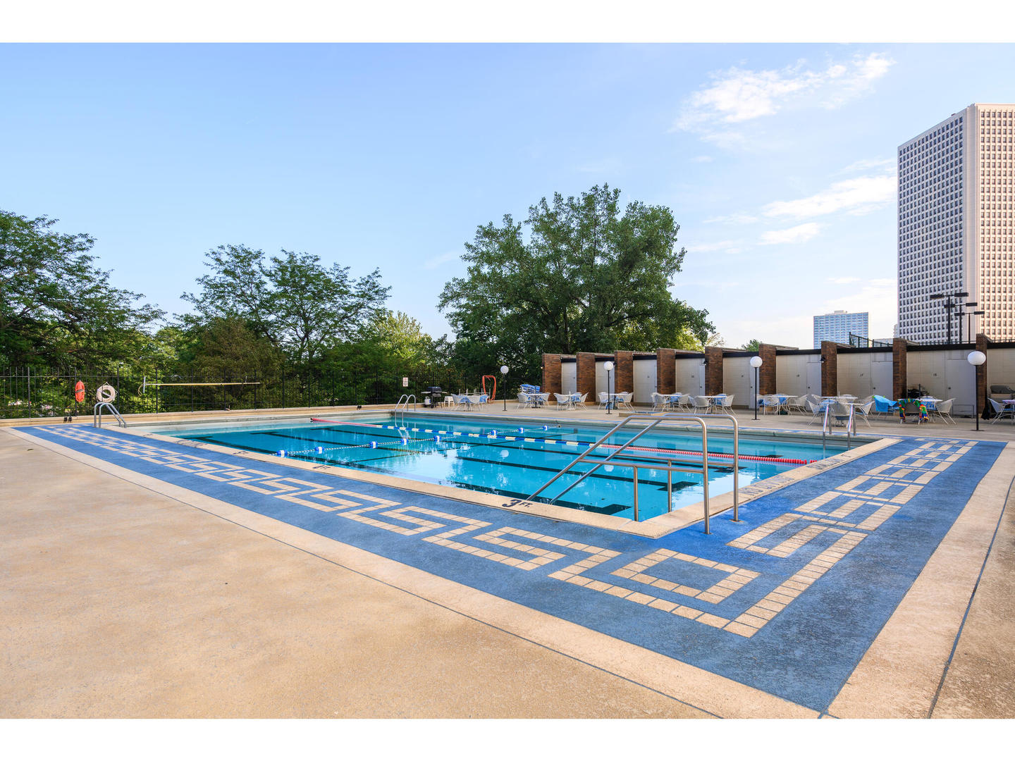 5445 North Sheridan Road, Unit 3404 Chicago, IL 60640 - Photo 24 of 24 a view of a swimming pool with a yard