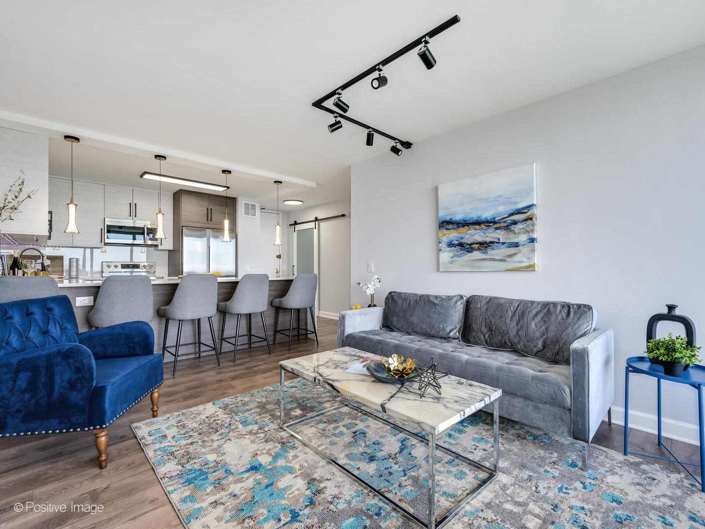 5445 North Sheridan Road, Unit 3404 Chicago, IL 60640 - Photo 9 of 24 a living room with furniture and wooden floor