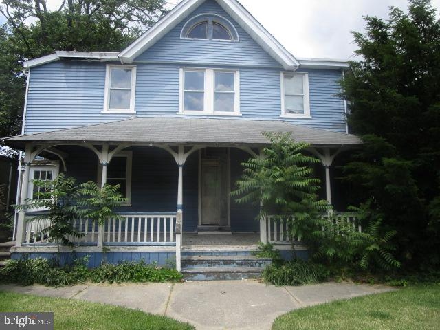 a front view of a house with a porch