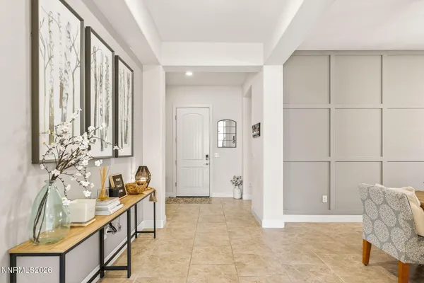 a large kitchen with kitchen island a refrigerator a stove a sink a dining table and chairs