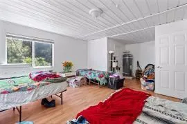 a living room filled with furniture and a table