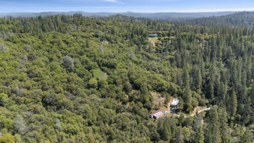 6360 Dean Road Mount Aukum, CA 95656 - Photo 5 of 19 a view of a city with lush green forest
