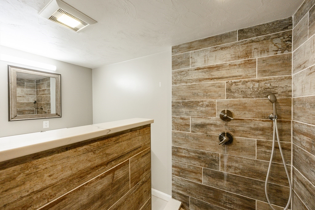 210 West Sixth Street, Unit 210 Boston, MA 02127 - Photo 20 of 36 a bathroom with a shower and a sink