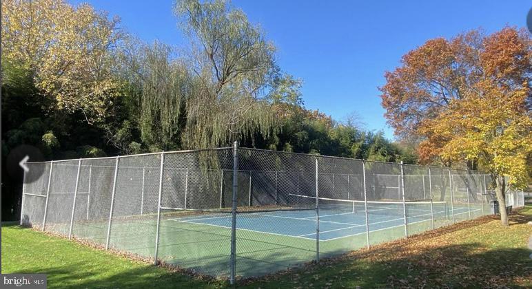 13 Fairway Road, Unit 13D Reading, PA 19607 - Photo 23 of 29 Serene tennis court amid autumn foliage.