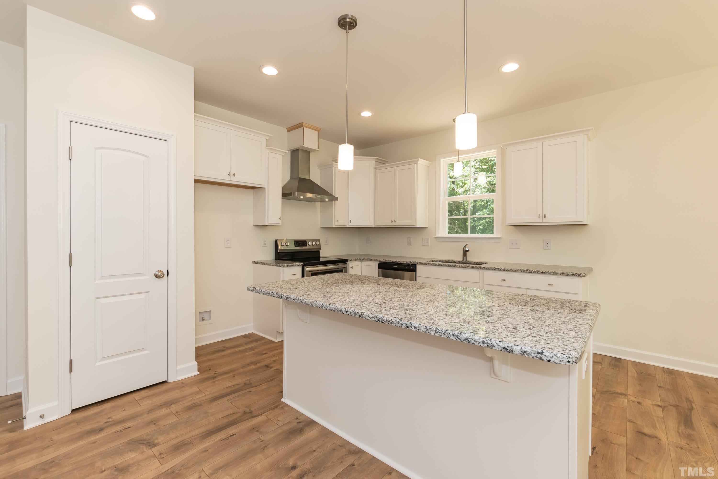 119 Carriage Loop Burlington, NC 27217 - Photo 11 of 29 a kitchen with kitchen island a sink stainless steel appliances and cabinets