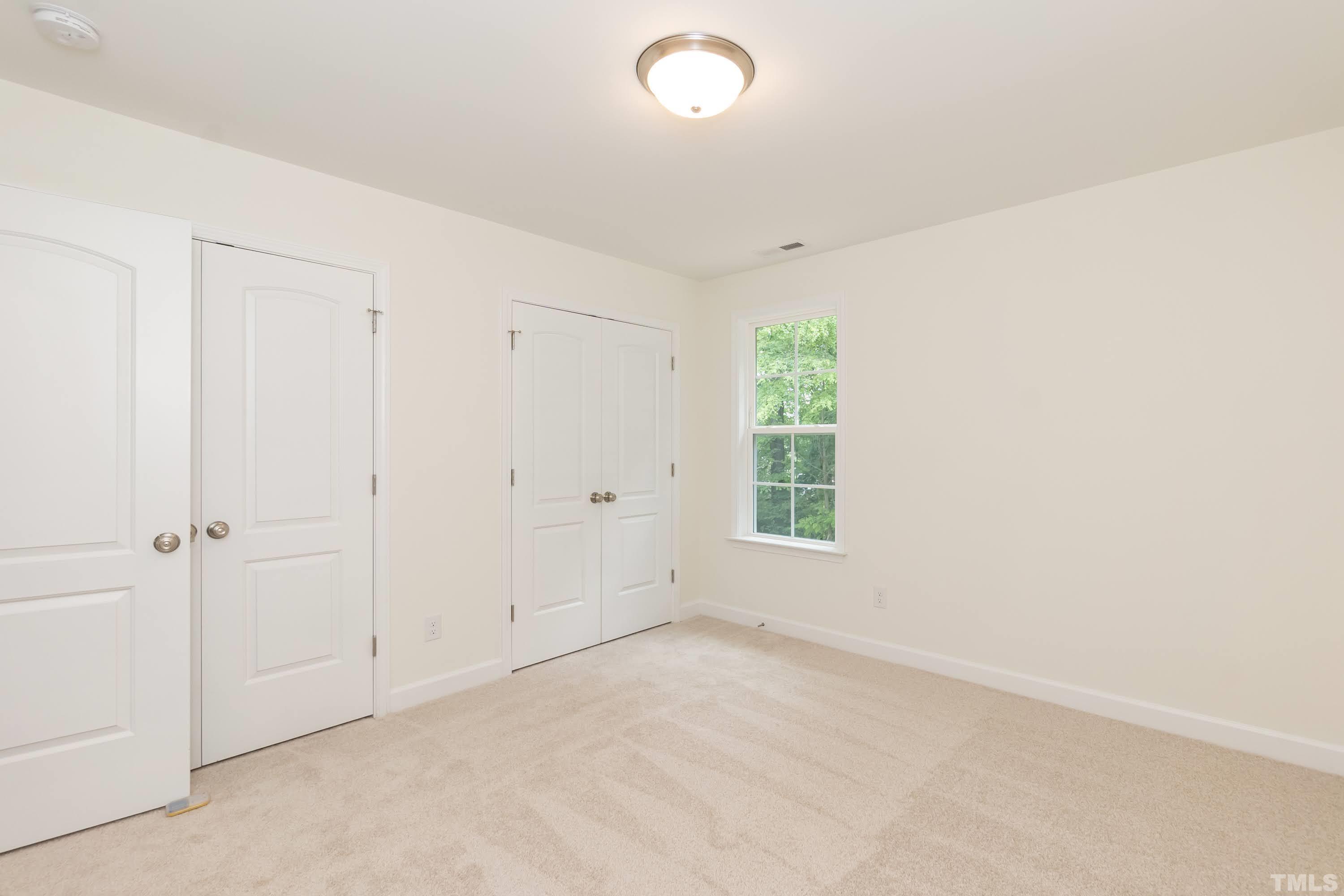 119 Carriage Loop Burlington, NC 27217 - Photo 22 of 29 an empty room with windows