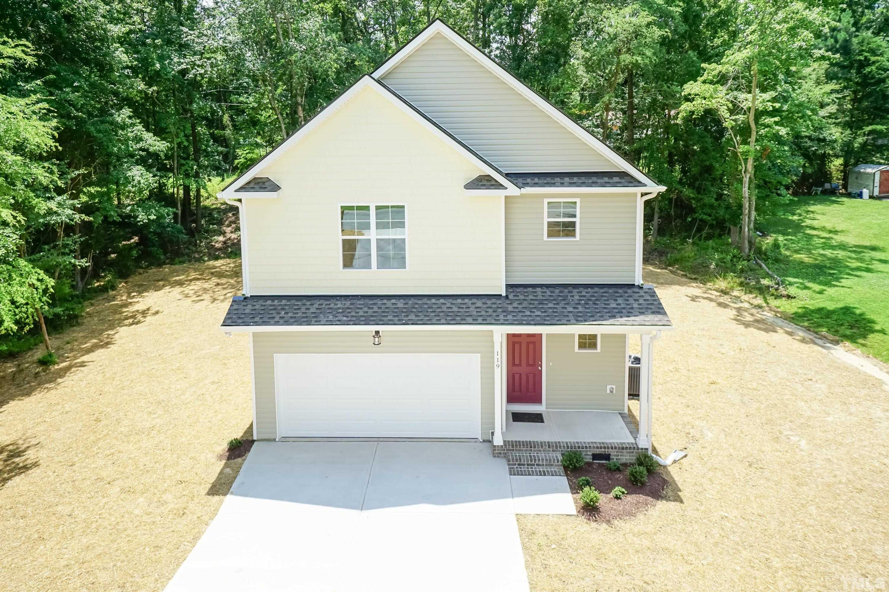 119 Carriage Loop Burlington, NC 27217 - Photo 29 of 29 a front view of a house with a yard