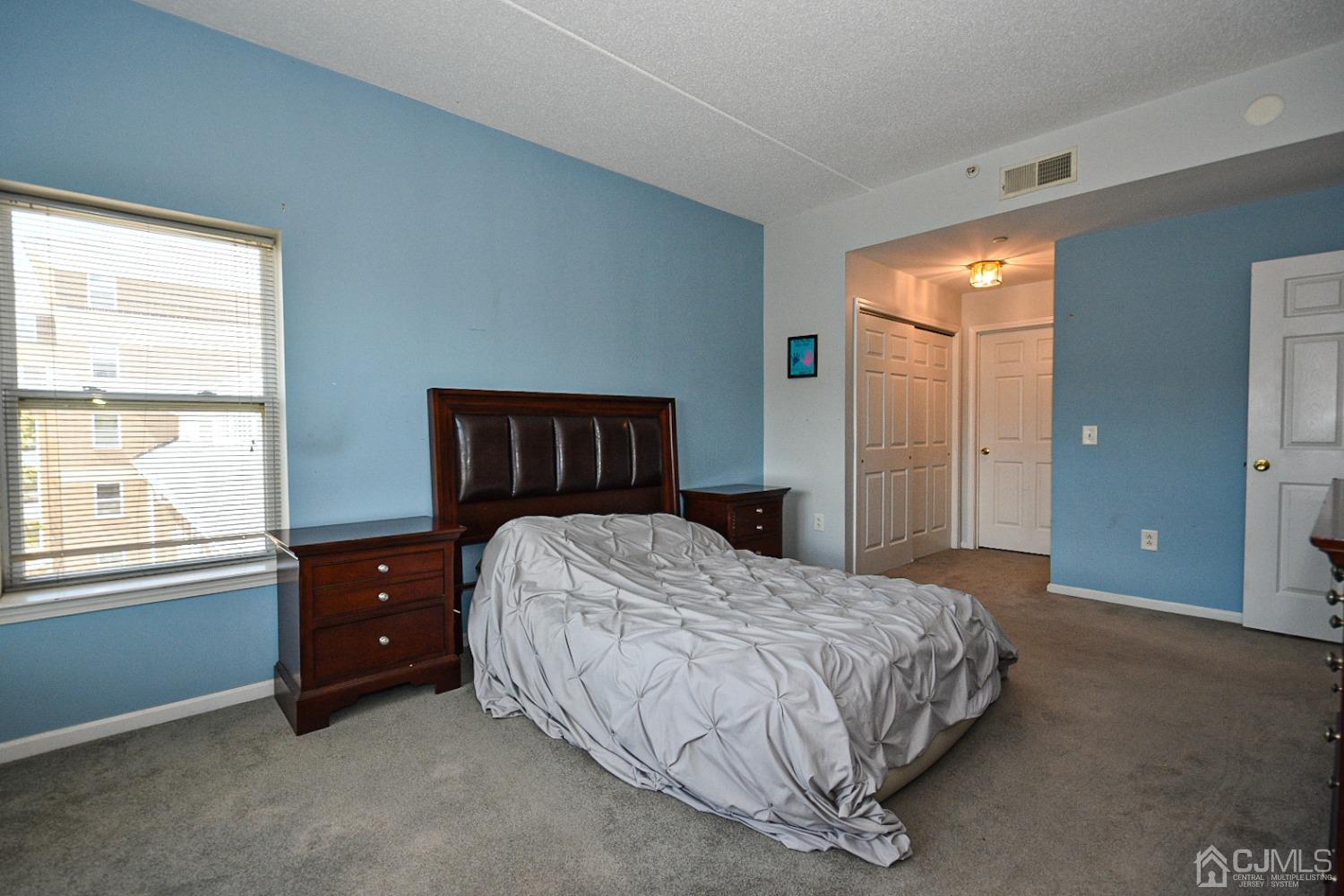 358 Rector Street, Unit 508 Perth Amboy, NJ 08861 - Photo 11 of 30 a bedroom with a bed and window