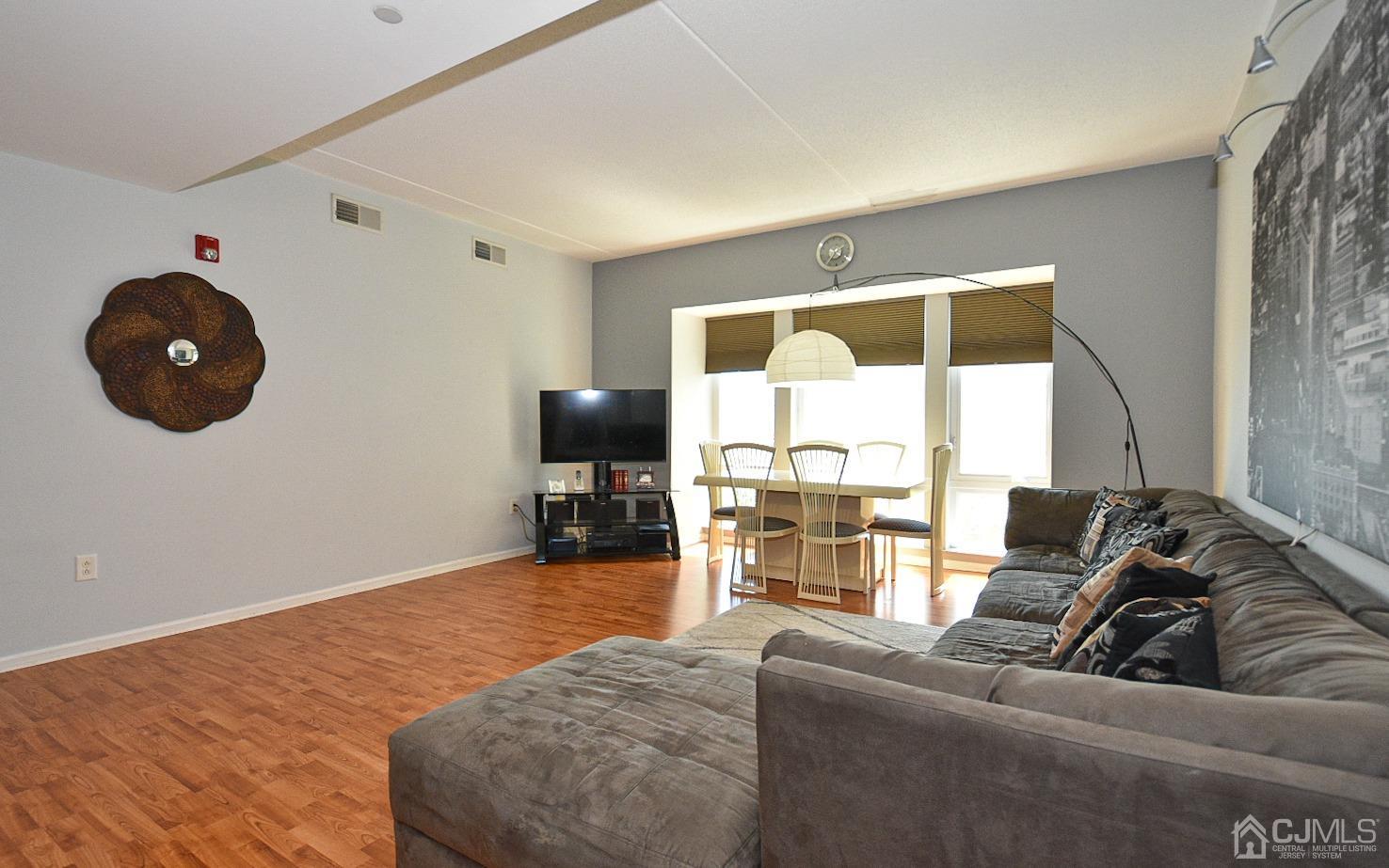 358 Rector Street, Unit 508 Perth Amboy, NJ 08861 - Photo 15 of 30 a living room with furniture and a large window