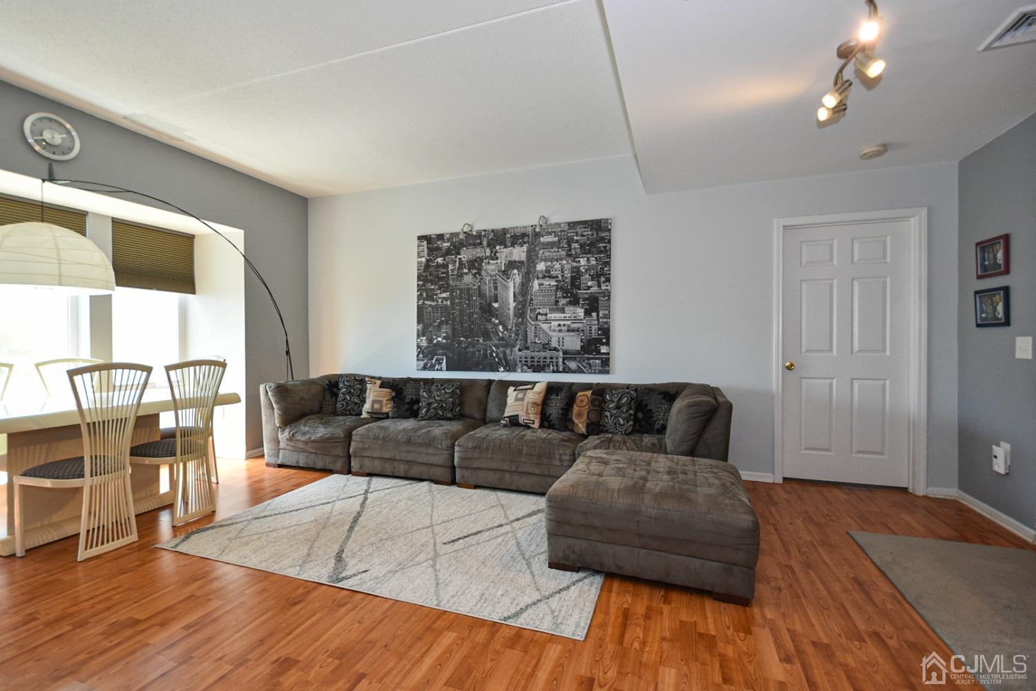 358 Rector Street, Unit 508 Perth Amboy, NJ 08861 - Photo 20 of 30 a living room with furniture and wooden floor