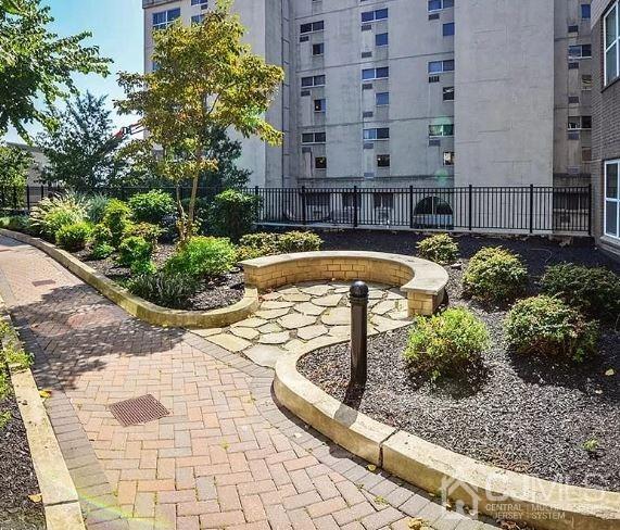 358 Rector Street, Unit 508 Perth Amboy, NJ 08861 - Photo 26 of 30 a view of a swimming pool with a lounge chairs