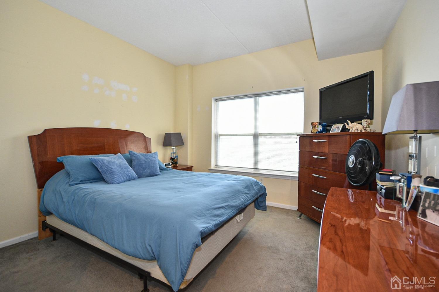 358 Rector Street, Unit 508 Perth Amboy, NJ 08861 - Photo 3 of 30 a bedroom with a bed and window