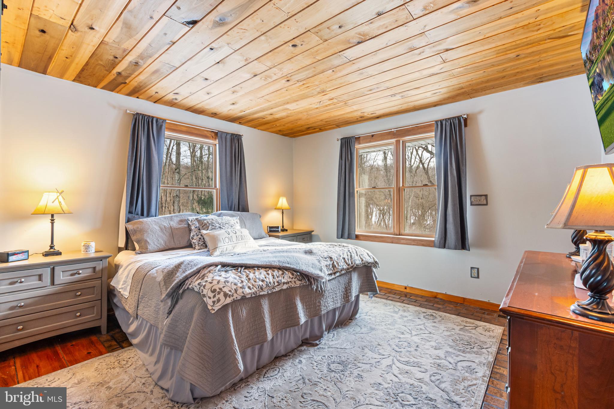 4507 Babylon Road Westminster, MD 21158 - Photo 30 of 63 a bed room with a bed and a dresser next to a window