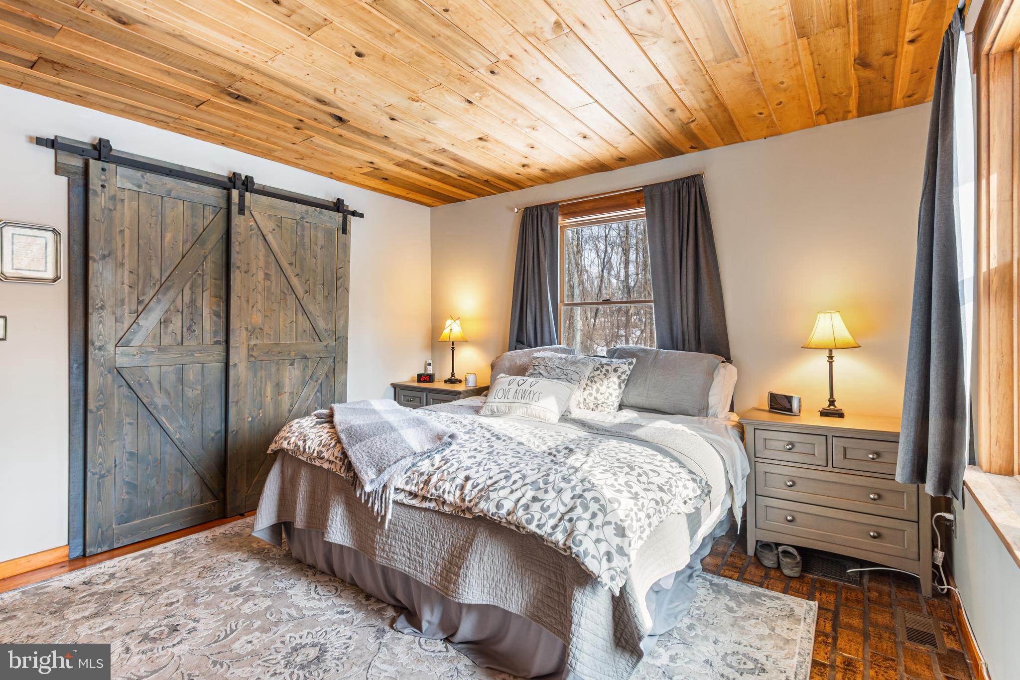 4507 Babylon Road Westminster, MD 21158 - Photo 31 of 63 a bedroom with a bed lamp and a large window