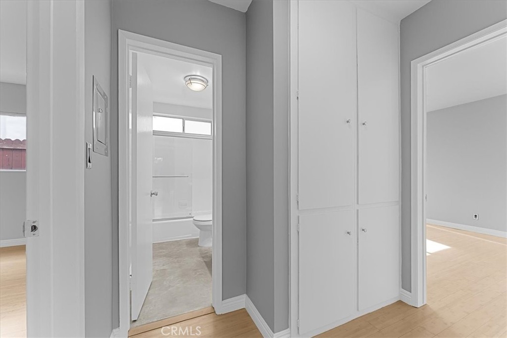 1527 Princeton Street, Unit 2 Santa Monica, CA 90404 - Photo 4 of 11 a view of a bathroom from a hallway with toilet