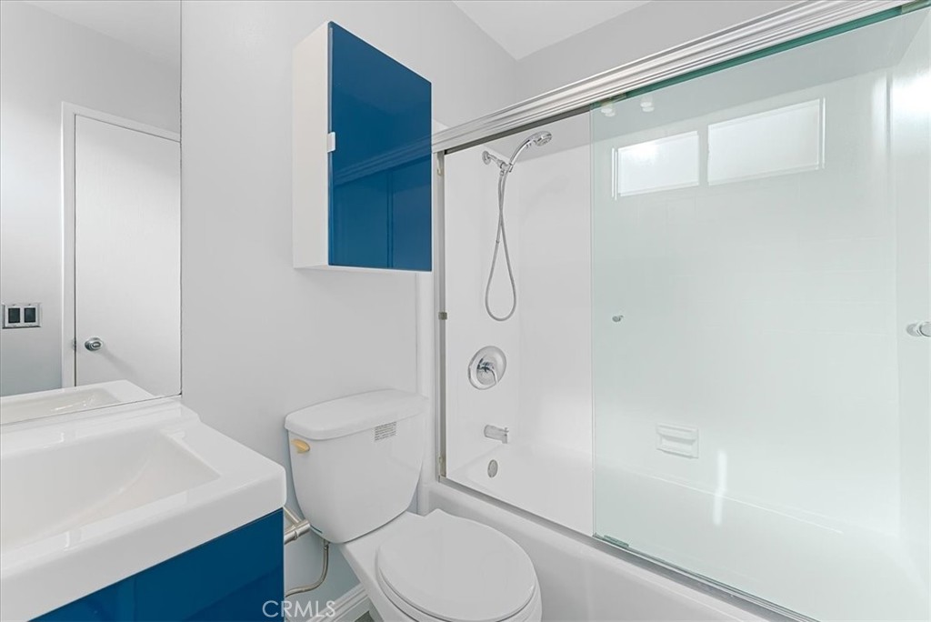 1527 Princeton Street, Unit 2 Santa Monica, CA 90404 - Photo 8 of 11 a white toilet sitting next to a bathroom sink