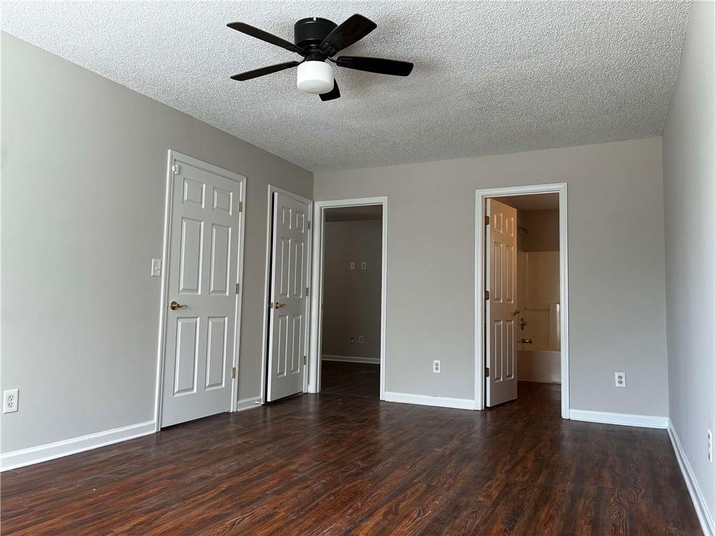 337 Madison Avenue Hampton, GA 30228 - Photo 25 of 32 an empty room to hallway with wooden floor and closet
