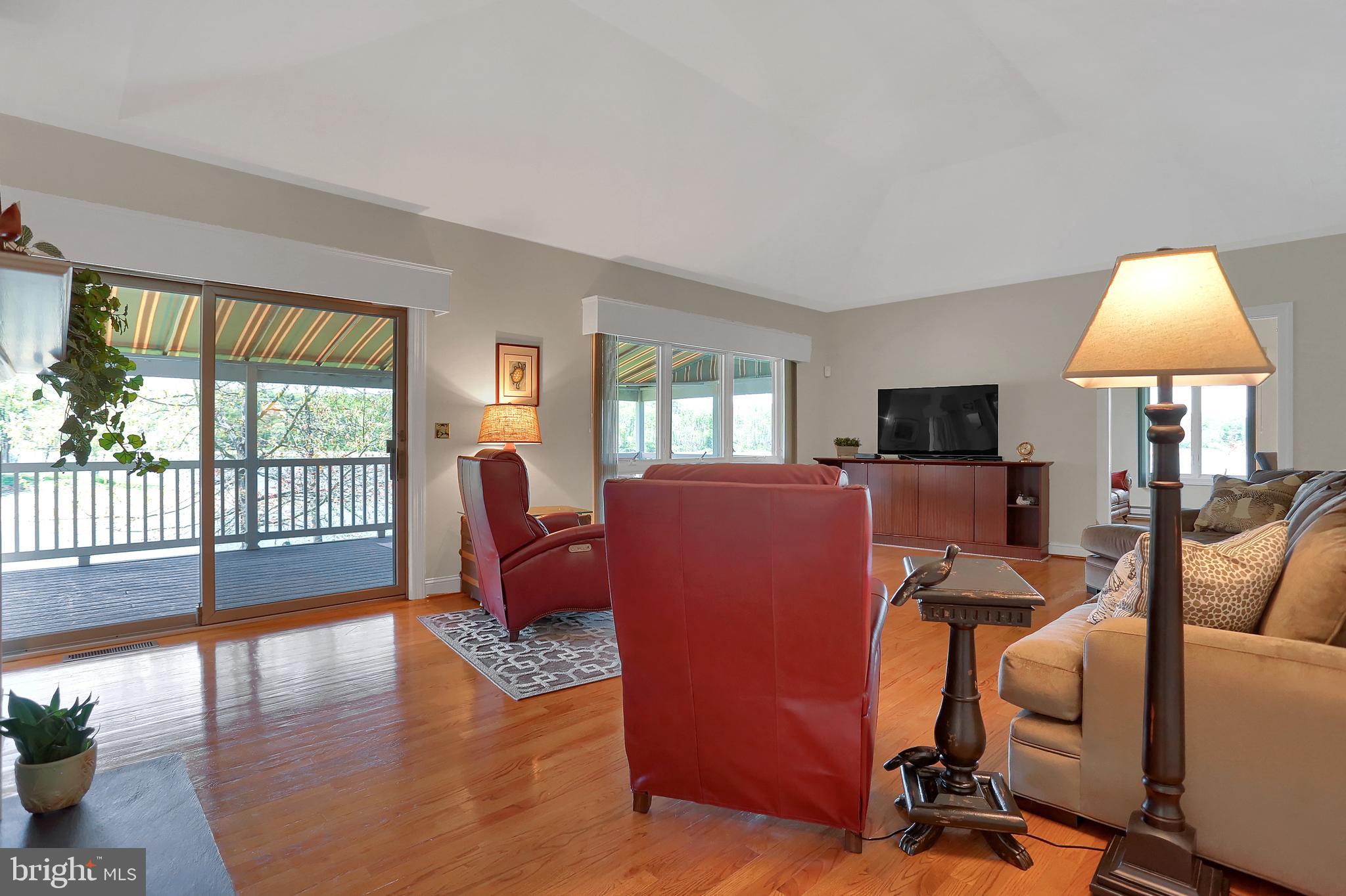 306 Deer Trail Drive Spring Grove, PA 17362 - Photo 11 of 44 Great room has windows & glass doors w/ lake views