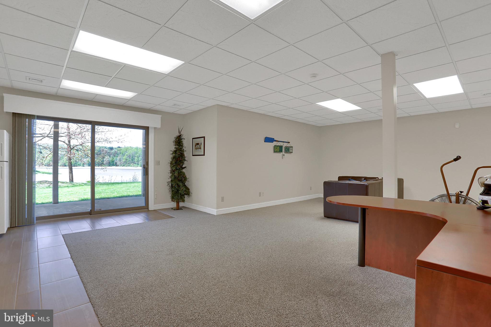 306 Deer Trail Drive Spring Grove, PA 17362 - Photo 29 of 44 Large L-shaped club room/game room with glass door