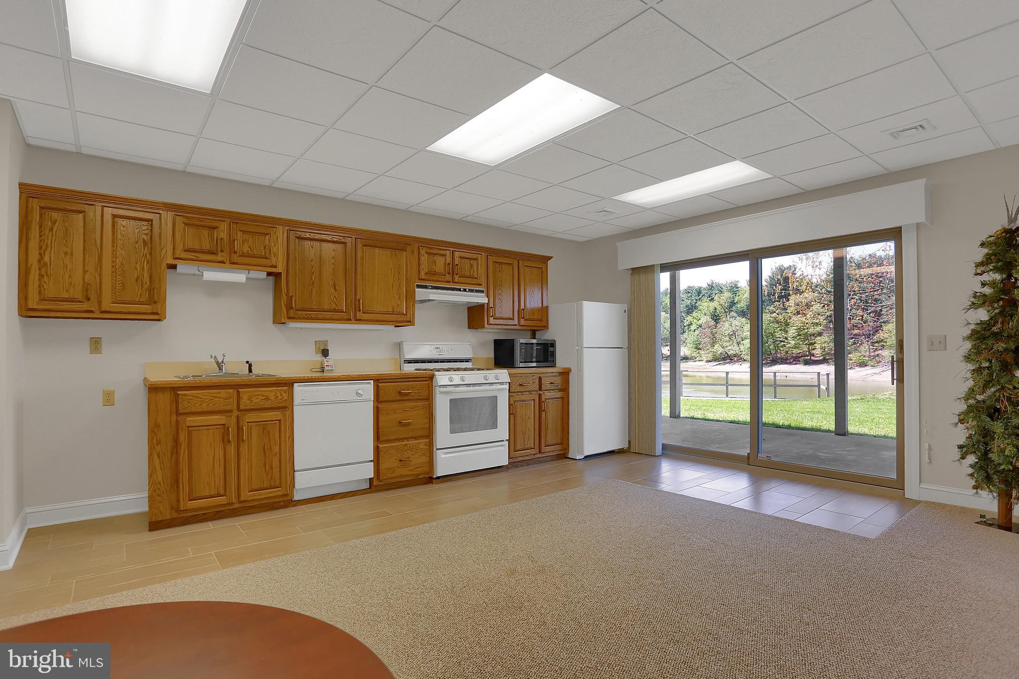306 Deer Trail Drive Spring Grove, PA 17362 - Photo 31 of 44 Full kitchen in clubroom/game room w/'view of lake