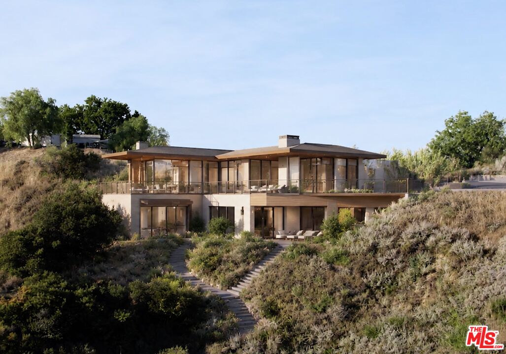 2300 Corsham Road Topanga, CA 90290 - Photo 7 of 13 a front view of a house with a yard
