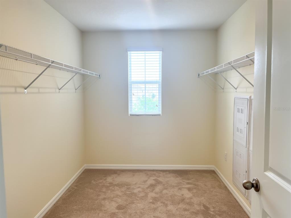 7690 Tuscan Bay Circle Wesley Chapel, FL 33545 - Photo 8 of 14 a view of an empty room with a window