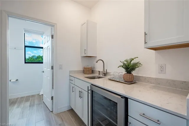 a kitchen with a sink and cabinets