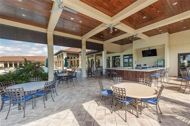 a view of a dinning table and chairs in the patio