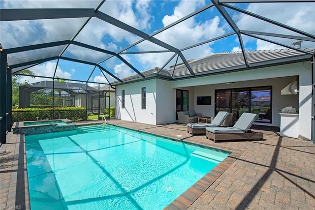 a view of swimming pool with outdoor seating