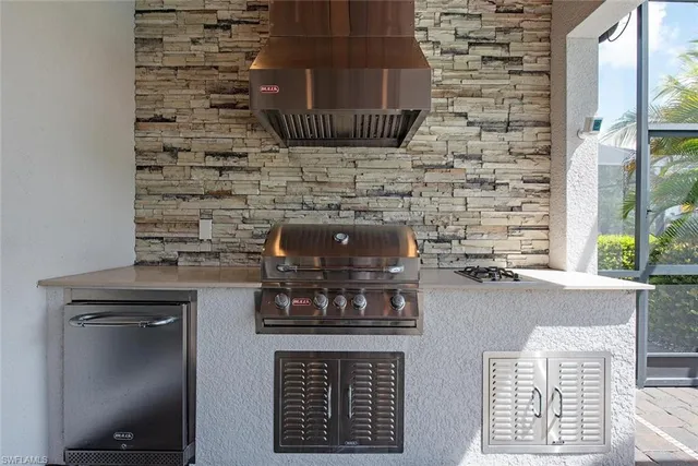 a kitchen with a stove and cabinets