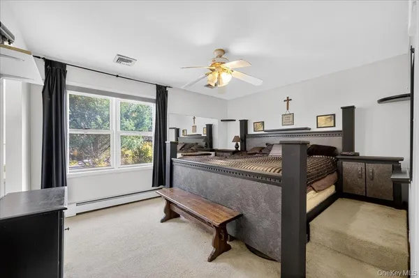 a kitchen with kitchen island a stove a sink and a refrigerator