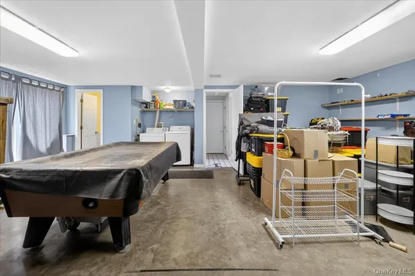 a bedroom with furniture and a gym equipment