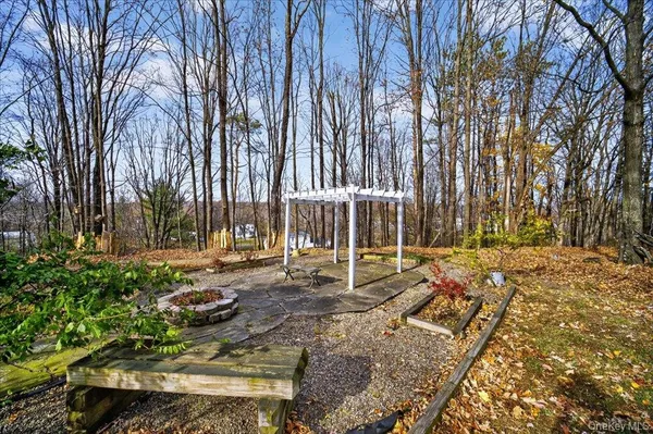 a view of a backyard with large trees