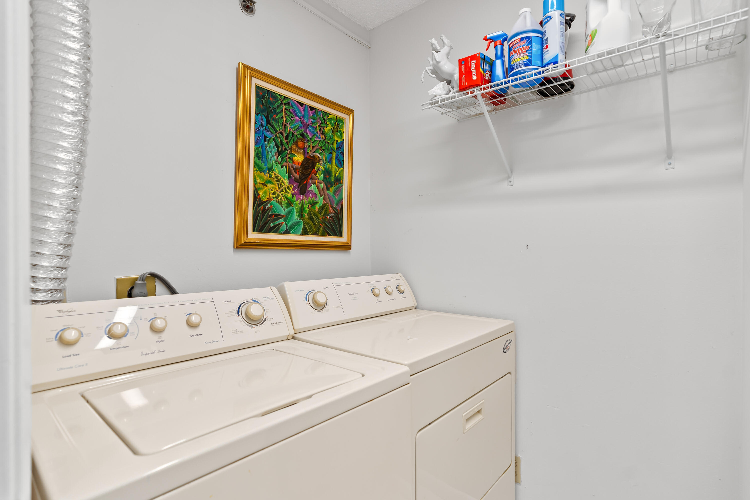 23200 Camino Del Mar, Unit 603 Boca Raton, FL 33433 - Photo 26 of 43 a utility room with dryer and washer