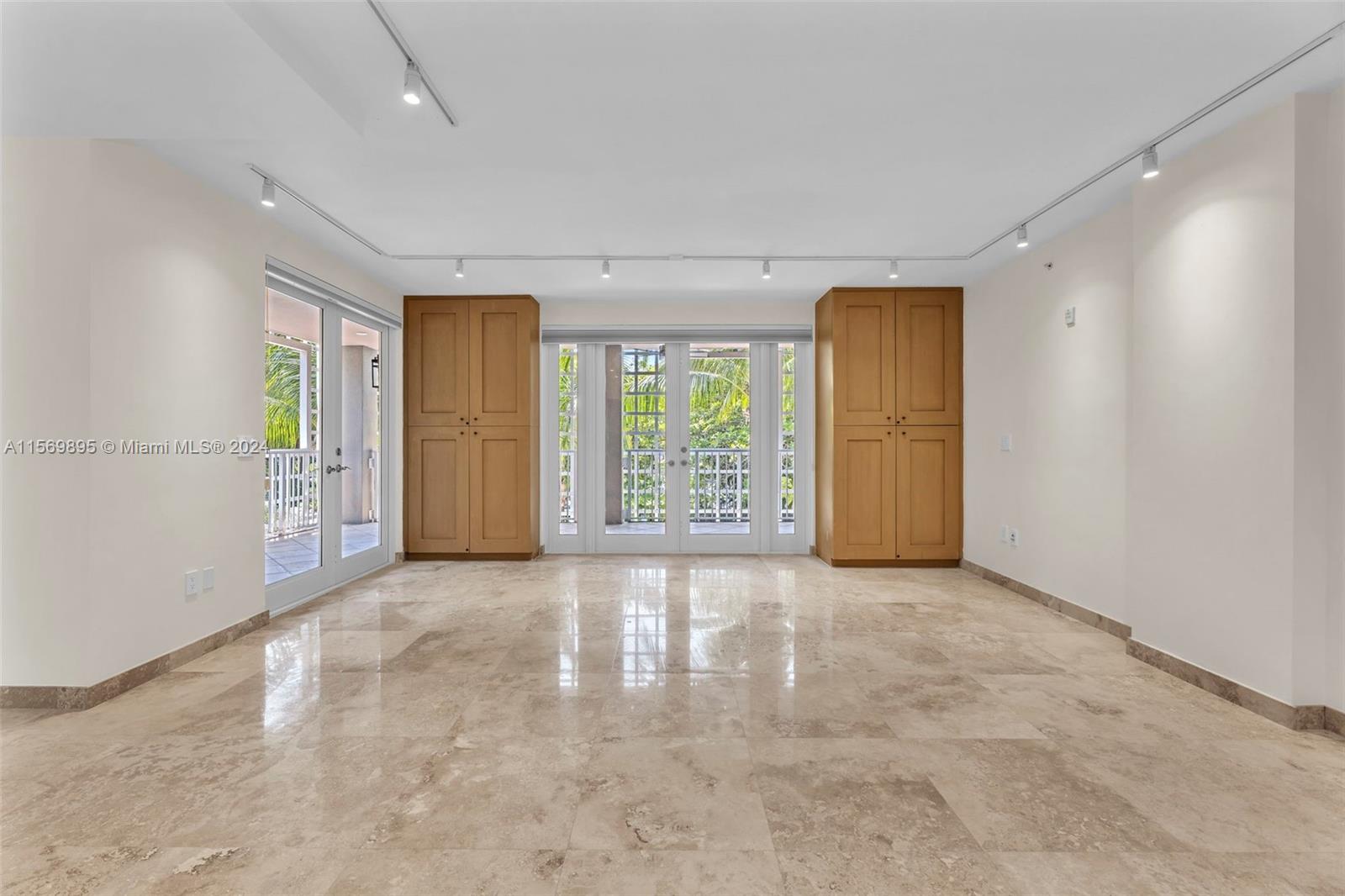 3540 Main Highway, Unit 310 Miami, FL 33133 - Photo 12 of 47 an empty room with windows and closet