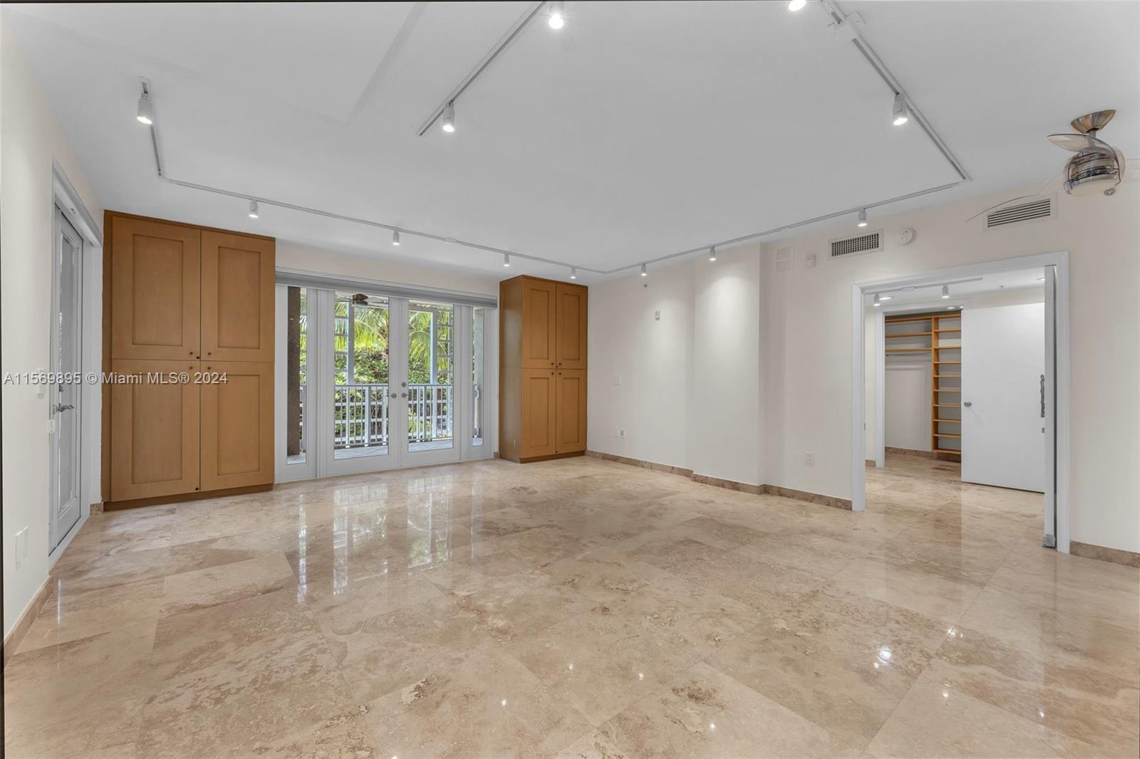 3540 Main Highway, Unit 310 Miami, FL 33133 - Photo 13 of 47 a view of an empty room with a window