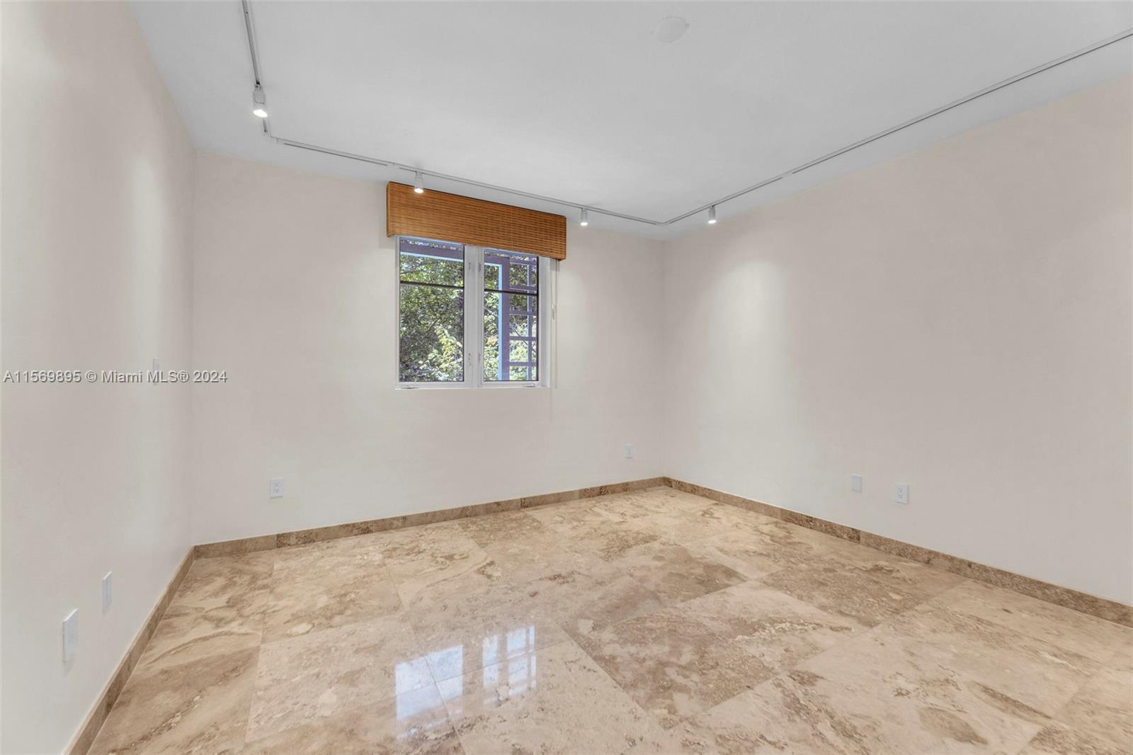 3540 Main Highway, Unit 310 Miami, FL 33133 - Photo 14 of 47 an empty room with a window