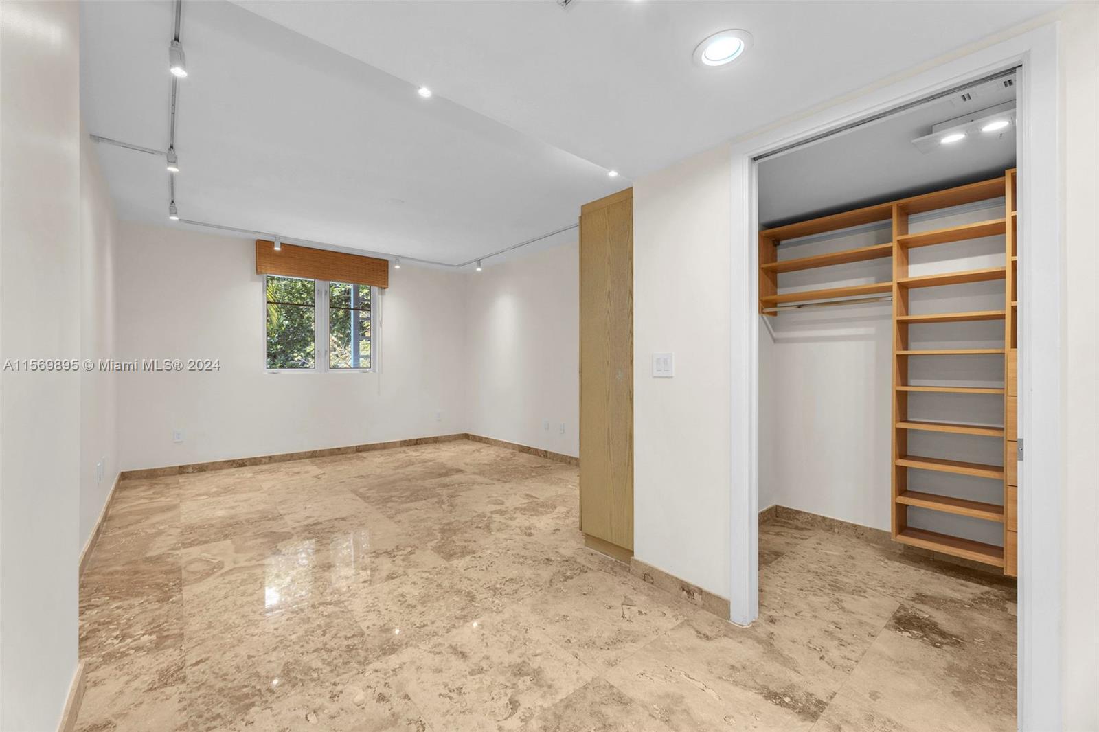 3540 Main Highway, Unit 310 Miami, FL 33133 - Photo 15 of 47 an empty room with windows and closet