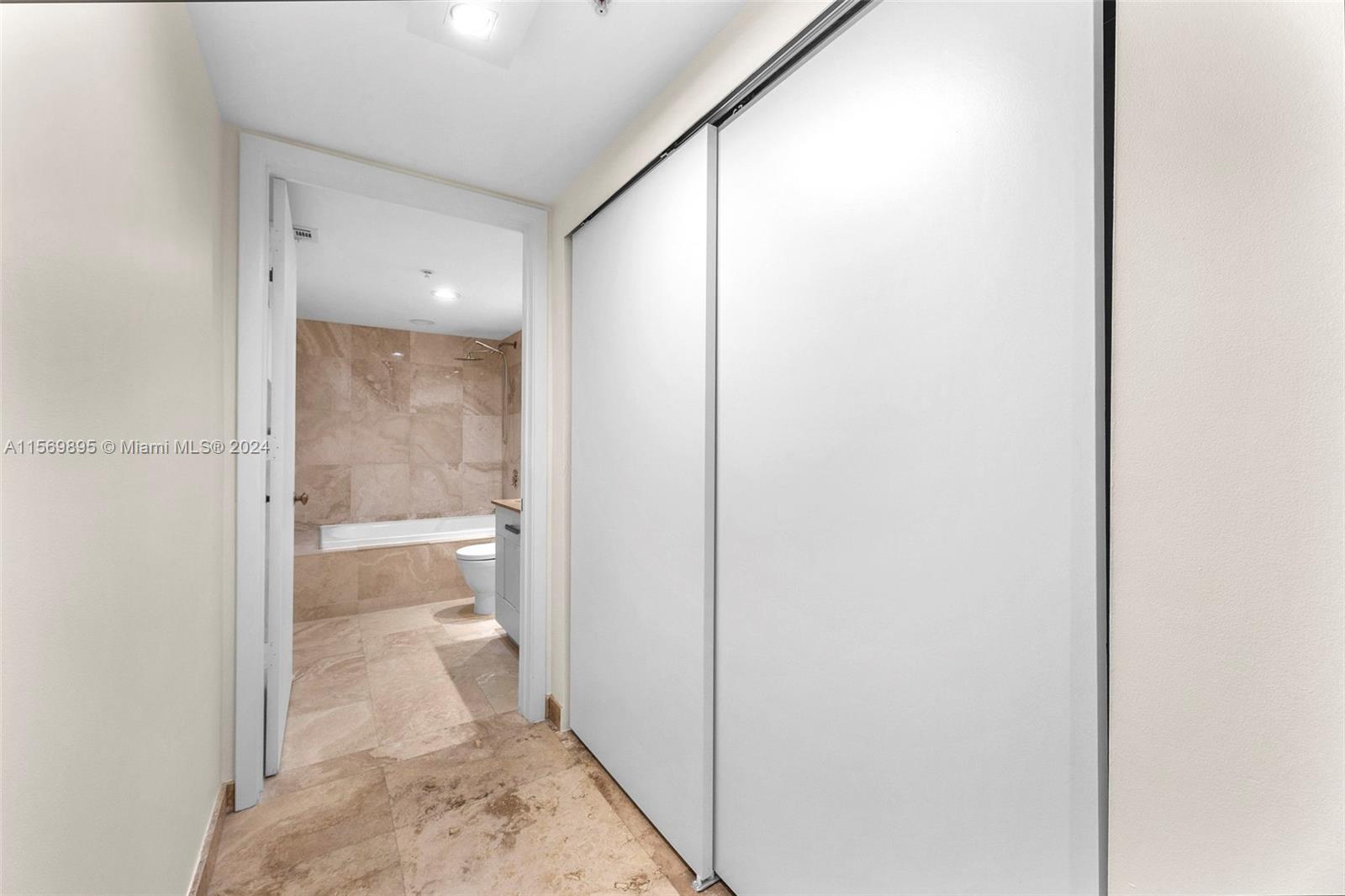 3540 Main Highway, Unit 310 Miami, FL 33133 - Photo 21 of 47 a view of a bathroom from a corridor
