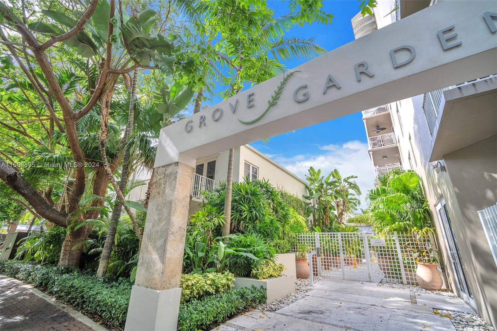 3540 Main Highway, Unit 310 Miami, FL 33133 - Photo 33 of 47 a front view of a building with garden