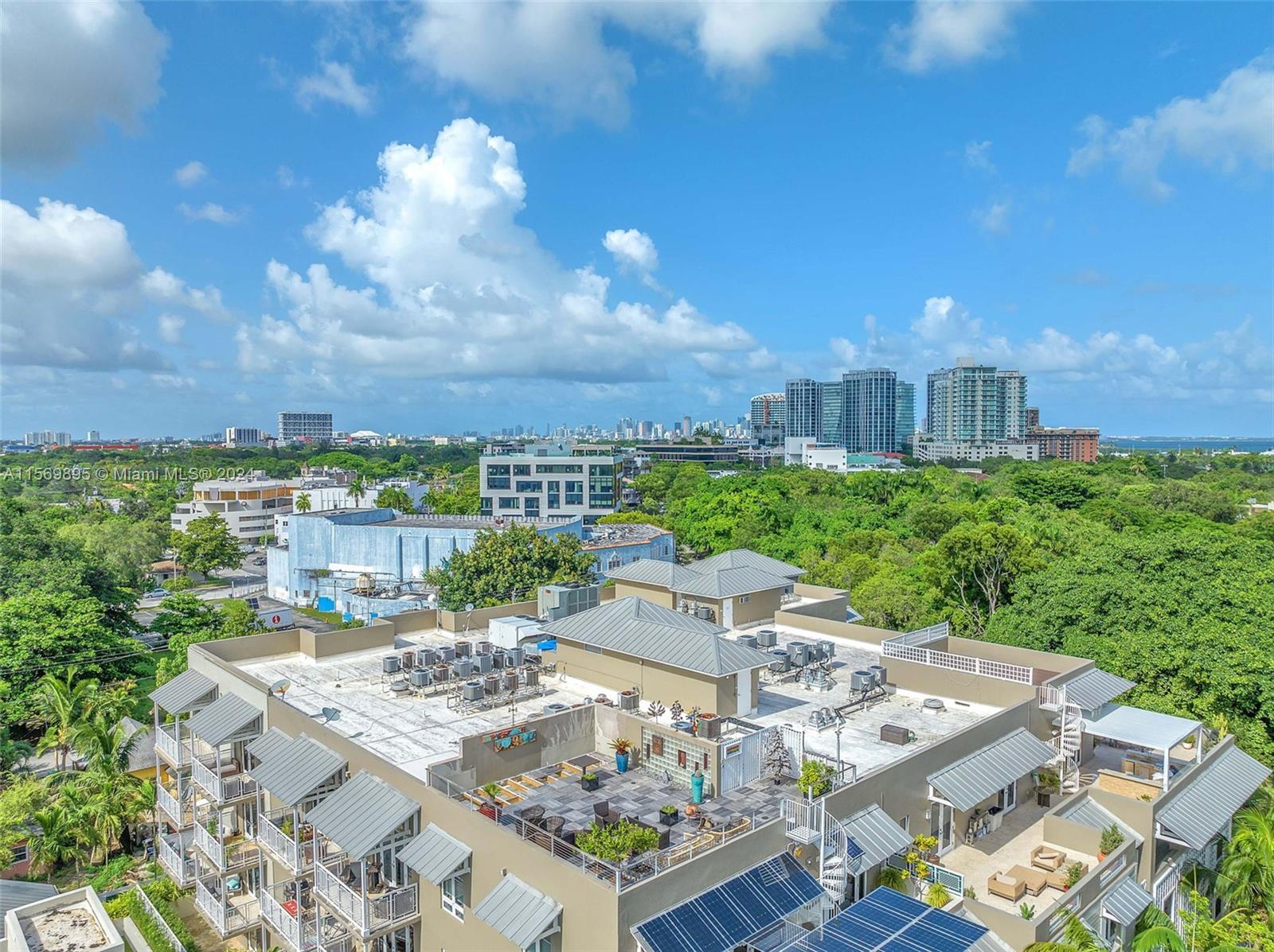 3540 Main Highway, Unit 310 Miami, FL 33133 - Photo 43 of 47 a view of a city from a terrace
