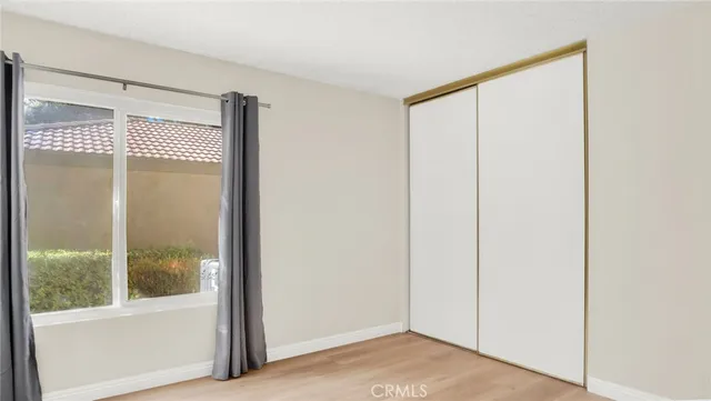 a car parked in front of a white house