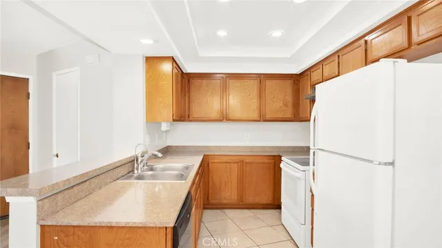 a view of an empty room with window and fire place