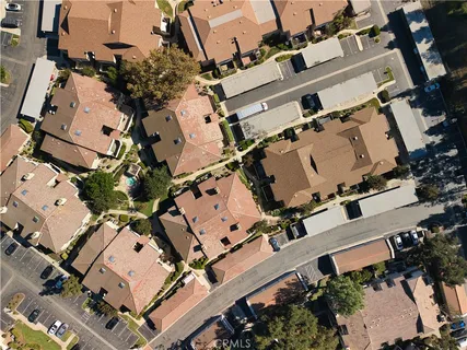 an aerial view of a building with parking