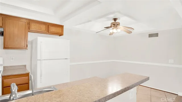 a view of empty room with wooden floor and fireplace