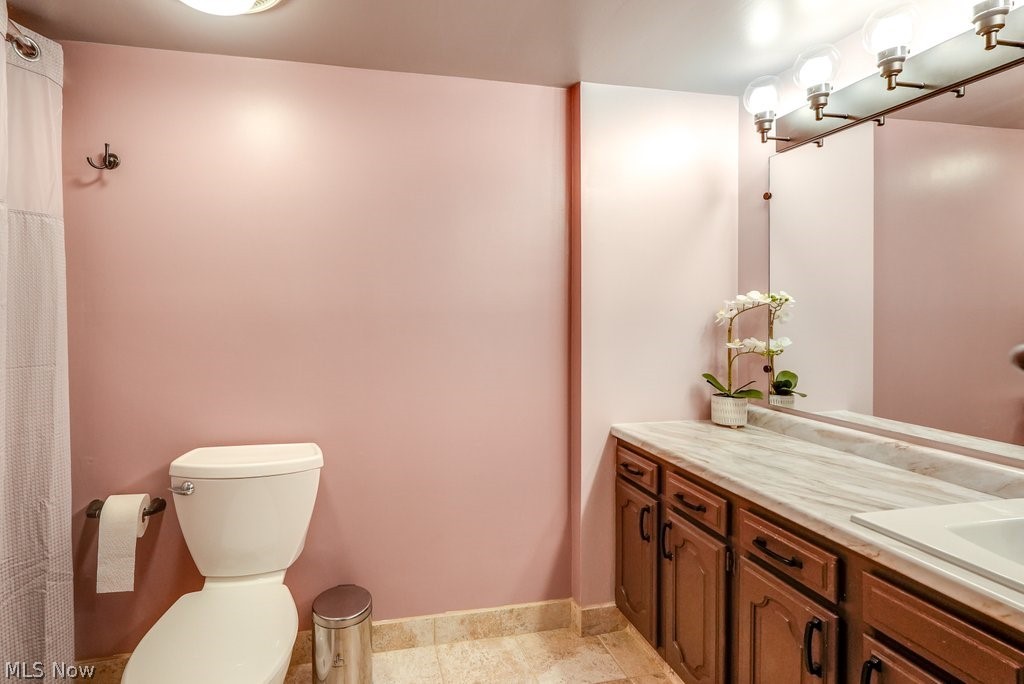 888 Hampton Ridge Drive Akron, OH 44313 - Photo 17 of 24 Full-bathroom featuring toilet, tile floors, shower, and vanity
