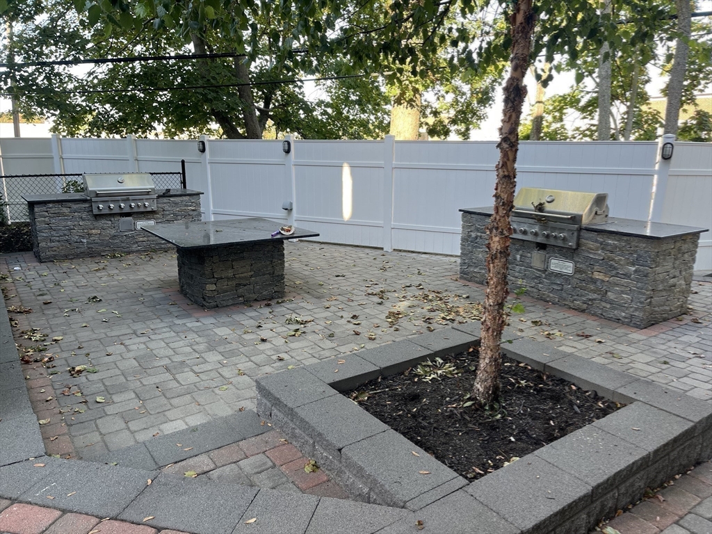 45 Spring Street, Unit 18 Boston, MA 02132 - Photo 27 of 29 a view of a backyard