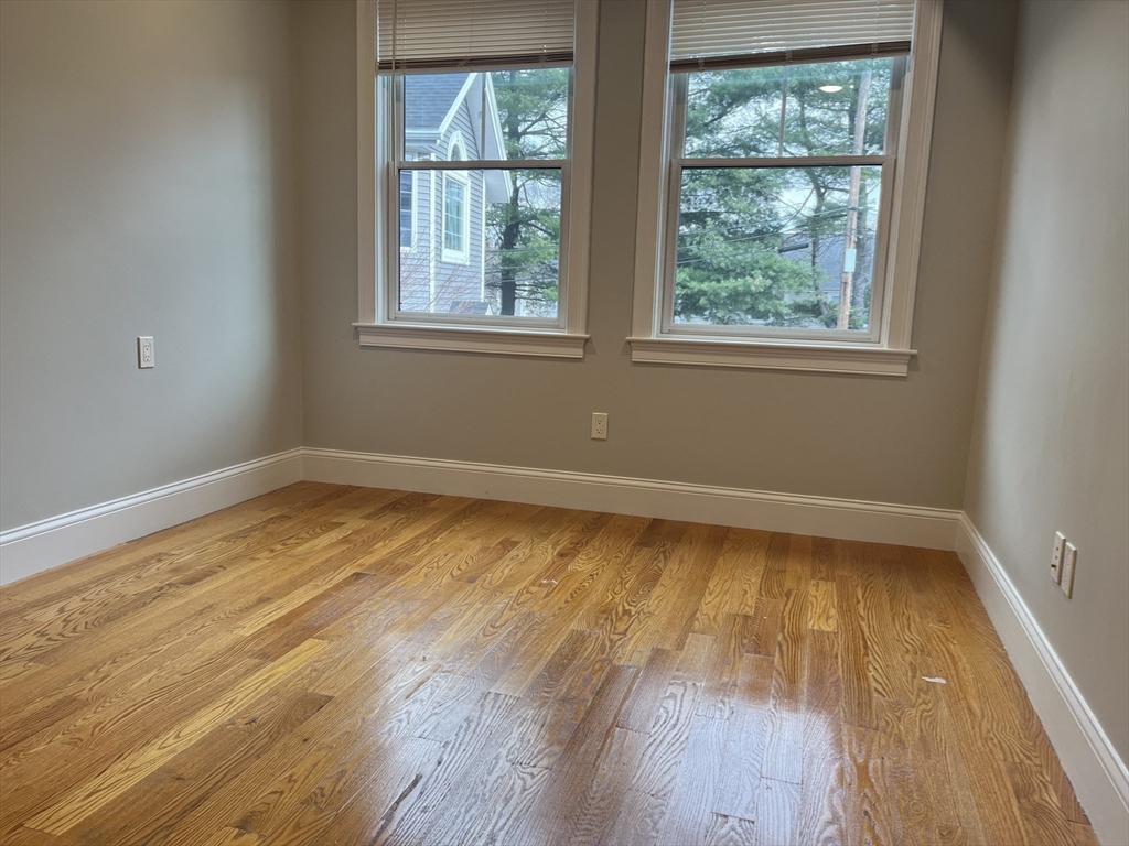 45 Spring Street, Unit 18 Boston, MA 02132 - Photo 7 of 29 a view of a room with wooden floor and a window