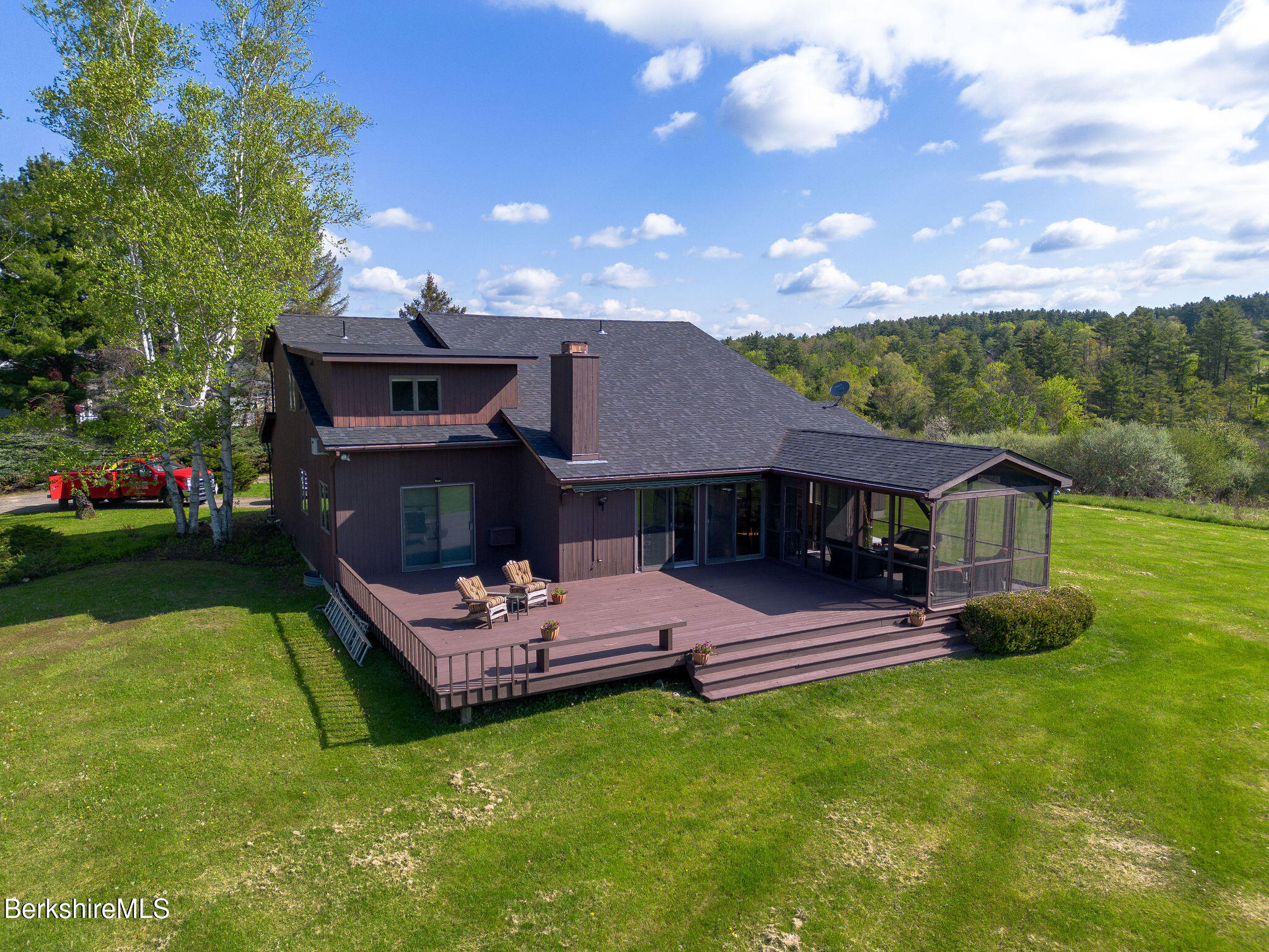 77 Hurlburt Road Great Barrington, MA 01230 - Photo 1 of 48 a view of a house with a yard porch and sitting area